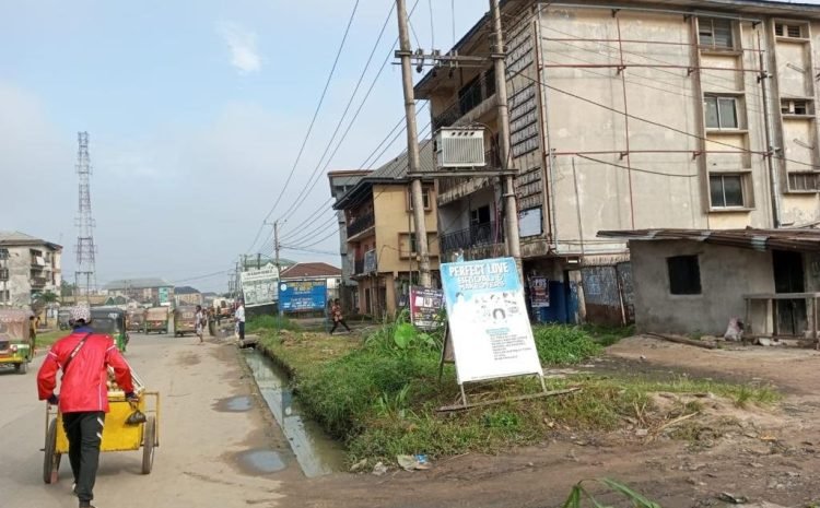 along Ikot Ekpene road by Amy Checkpoint0